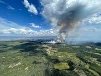 This July 27, 2023, aerial image from the British Columbia Wildfire Service, shows smoke from the  the Ross Moore wildfire south of Kamloops, British Columbia, Canada. (Photo by Handout / BC Wildfire Service / AFP) / RESTRICTED TO EDITORIAL USE - MANDATORY CREDIT "AFP PHOTO / BC Wildfire Service / Handout" - NO MARKETING NO ADVERTISING CAMPAIGNS - DISTRIBUTED AS A SERVICE TO CLIENTS (Photo by HANDOUT/BC Wildfire Service/AFP via Getty Images)
