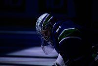 Vancouver Canucks goalie Jaroslav Halak, of Slovakia, stretches before an NHL hockey game against the Philadelphia Flyers in Vancouver, B.C., Thursday, Oct. 28, 2021.&nbsp;The NHL has postponed two games each for the Vancouver Canucks and Toronto Maple Leafs as COVID-19 cases continue to grow throughout the league.&nbsp;THE CANADIAN PRESS/Darryl Dyck