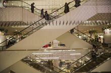 Shoppers take the escalators looking for Boxing Day deals at a Nordstrom store in downtown Toronto on Monday, December 26, 2017. Nordstrom's forthcoming summer departure from Canada's retail landscape will leave massive holes in malls that some analysts say landlords will have to get creative to fill. THE CANADIAN PRESS/Christopher Katsarov
