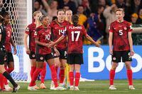 Canada’s Ashley Lawrence (left to right), Vanessa Gilles, Jessie Fleming and Quinn react after conceding the third goal during second half Group B soccer action against Australia at the FIFA Women's World Cup in Melbourne, Australia, Monday, July 31, 2023. THE CANADIAN PRESS/Scott Barbour