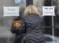 A customer enters a restaurant with help wanted signs Wednesday, November 17, 2021 in Laval, Que. Statistics Canada says the number of job vacancies at the beginning of April hit just over one million, up more than 40 per cent compared with a year earlier. THE CANADIAN PRESS/Ryan Remiorz