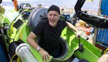 Filmmaker and National Geographic Explorer-in-Residence James Cameron emerges from the Deepsea Challenger submersible after his successful solo dive to the Mariana Trench, the deepest part of the ocean, Monday March 26, 2011.
