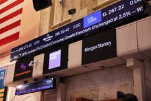 The Goldman Sachs and Morgan Stanley company names are seen at the New York Stock Exchange during morning trading on Jan. 17.