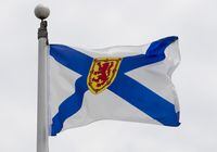 Nova Scotia's provincial flag flies in Ottawa, Friday July 3, 2020. Legislation to recognize Mi'kmaq as Nova Scotia's first language has been proclaimed by the province and affirmed by Mi'kmaw chiefs. THE CANADIAN PRESS/Adrian Wyld