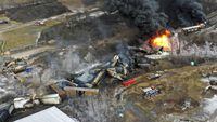 In this photo taken with a drone, portions of a Norfolk Southern freight train that derailed the previous night in East Palestine, Ohio, remain on fire at mid-day on Feb. 4.