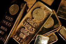 Gold bars are displayed to be photographed at bullion house in Mumbai Dec. 3, 2009.