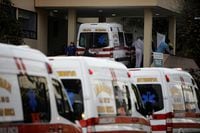 Ambulances carrying patients with symptoms of the coronavirus disease (COVID-19) are queued outside the General Hospital as paramedics are searching for available hospital beds, in Mexico City, Mexico January 7, 2021. Picture taken January 7, 2021. REUTERS/Luis Cortes