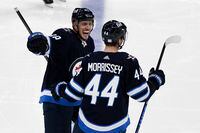Winnipeg Jets' Josh Morrissey (44) celebrates his goal against the Dallas Stars' with teammate Nate Schmidt (88) during the second period of NHL action in Winnipeg on Tuesday, November 2, 2021. THE CANADIAN PRESS/Fred Greenslade