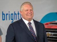 Ontario Premier Doug Ford listens during an announcement at General Motors Canada’s Canadian Technical Centre,  McLaughlin Advanced Technology Track in Oshawa, Ontario on Monday April 4, 2022. THE CANADIAN PRESS/Frank Gunn