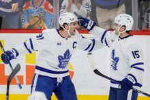Mar 23, 2023; Sunrise, Florida, USA; Toronto Maple Leafs center Alexander Kerfoot (15) celebrates with center John Tavares (91) after scoring during the third period against the Florida Panthers at FLA Live Arena. Mandatory Credit: Sam Navarro-USA TODAY Sports