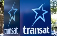 An Air Transat sign is seen in Montreal on May 31, 2016.T THE CANADIAN PRESS/Paul Chiasson