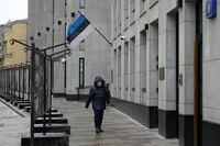 A pedestrian walks past the Estonian Embassy in Moscow, Russia, Monday, Jan. 23, 2023. Russia is expelling Estonia's Ambassador to Russian Federation Margus Laidre and the country's diplomatic mission will be headed by a charge d'affaires, the Russian Foreign Ministry said Monday. Estonian Ambassador Margus Laidre was ordered to leave the country by Feb. 7, the ministry said. (AP Photo/Alexander Zemlianichenko)