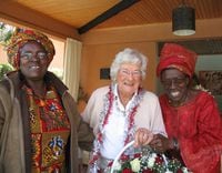 Bridget Lawson, centre, who worked in Africa a volunteer in later life, on visit to AMREF in 2010. Courtesy of Family