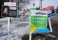 Condo for sale signs are seen in Deux-Montagnes, Que., Wednesday, March 29, 2023. THE CANADIAN PRESS/Ryan Remiorz