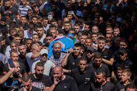 Mourners carry the body of Palestinian killed in an Israeli raid Osaid Abu Ali, 21, during his funeral at the Nur Shams refugee camp near the northern city of Tulkarm in the occupied West Bank on September 24, 2023. Israeli forces shot dead two Palestinians in a pre-dawn raid in the West Bank on September 24, the Palestinian health ministry said, as the army confirmed it dismantled a militant "operational command centre" in the occupied territory. (Photo by Jaafar ASHTIYEH / AFP) (Photo by JAAFAR ASHTIYEH/AFP via Getty Images)