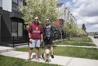 Alan Martino (left), Tony Wang and their dog Mogo are photographed in front of their townhome in Calgary on Wednesday, May 25, 2022. Martino and Wang met while Martino completed his masters in Lethbridge before the pair moved to Ottawa where Martino completed his PhD. Yesterday, they arrived in Calgary where Martino has taken a professorship at the Cummings School of Medicine. (Photo by Sarah B Groot/The Globe and Mail)