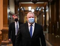 Ontario Premier Doug Ford Ontario walks to his press conference during the COVID-19 pandemic in Toronto, Friday, November 20, 2020. Ontario is moving the COVID-19 hot spots of Toronto and Peel Region into lockdown starting Monday. THE CANADIAN PRESS/Nathan Denette