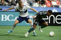Sep 14, 2022; Vancouver, British Columbia, CAN;  LA Galaxy forward Dejan Joveljic (99) controls the ball against Vancouver Whitecaps FC defender Julian Gressel (19) during the second half at BC Place. Mandatory Credit: Anne-Marie Sorvin-USA TODAY Sports
