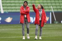 Morocco's Nouhaila Benzina, left, and Fatima Gharbi walk around the ground during a familiarization tour ahead of their Women's World Cup Group H match against Germany in Melbourne, Australia on July 23.