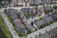 Houses and townhouses are seen in an aerial view, in Langley, B.C., on Wednesday May 16, 2018. The Real Estate Board of Greater Vancouver says February's home sales were up 76.9 per cent from January, but down 47.2 per cent from the year before.THE CANADIAN PRESS/Darryl Dyck