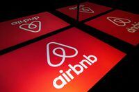 (FILES) This file illustration photo taken on November 22, 2019, shows the logo of the online lodging service Airbnb displayed on a tablet in Paris. - Home rental service Airbnb is shutting down its business in China as a pandemic lockdown shows no sign of ending there, a source close to the company told AFP on May 23, 2022. (Photo by Lionel BONAVENTURE / AFP) (Photo by LIONEL BONAVENTURE/AFP via Getty Images)