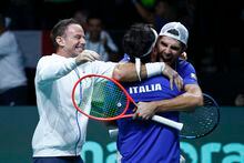 Team Italy captain Filippo Volandri, left, smiles as Simone Bolelli hugs Fabio Fognini after defeating Tommy Paul and Jack Sock of the USA in a Davis Cup quarter-final tennis match between Italy and USA in Malaga, Spain, Thursday, Nov. 24, 2022. (AP Photo/Joan Monfort)