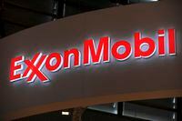 (FILES) This file photograph taken on June 2, 2015, shows the logo of US oil and gas giant ExxonMobil during the World Gas Conference exhibition in Paris. - Exxon Mobil closed the books on a terrible 2020 on February 2, 2021, reporting losses in the fourth-quarter and for the full year in the wake of lower oil prices with Covid-19. The big US oil company reported a fourth-quarter loss of $20.7 billion following huge write-offs. That took the company's loss for all of 2020 to $22.4 billion, compared with $14.3 billion in profits in 2019. Exxon Mobil also unveiled plans for additional spending cuts of $3 billion in annual expenses expected by 2023, its latest belt-tightening move amid the industry downturn. (Photo by ERIC PIERMONT / AFP) (Photo by ERIC PIERMONT/AFP via Getty Images)