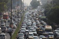 FILE PHOTO: Vehicles queue at a traffic light on a hazy morning in New Delhi, India, October 16, 2020. REUTERS/Anushree Fadnavis/File Photo