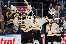 Feb 1, 2023; Toronto, Ontario, CAN; Boston Bruins goaltender Linus Ullmark (35) and goaltender Jeremy Swayman (1) celebrate a win over the Toronto Maple Leafs during the third period at Scotiabank Arena. Mandatory Credit: John E. Sokolowski-USA TODAY Sports