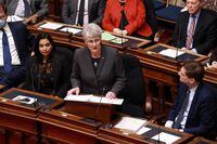 Minister of Finance Katrine Conroy tables her first budget as Premier David Eby looks on in the legislative assembly at legislature in Victoria, Tuesday, Feb. 28, 2023. THE CANADIAN PRESS/Chad Hipolito 