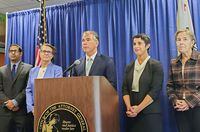 California Attorney General Rob Bonta, at lectern and flanked by staff, announces an antitrust lawsuit against Amazon.com Inc during a news conference in San Francisco, California, U.S. September 14, 2022. REUTERS/Paresh Dave