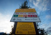 A sign showing an avalanche hazard warning near Mount Renshaw outside of McBride, B.C., on Saturday January 30, 2016. Two people were killed and two others were injured in two separate avalanches in B.C. Monday. THE CANADIAN PRESS/Darryl Dyck