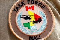 The badge on a sleeve of a Canadian soldier of the MINUSMA (United Nations Multidimensional Integrated Stabilization Mission in Mali) force is seen at the contigents' camp in Gao, Mali on July 31, 2018.
Canadian troops have been arriving in Mali since the end of July 2018 to take part in the peacekeeping mission, considered the UN's deadliest. A spokesman for Canada's defense ministry said the mission "is planned from August 2018 to July 2019." In March, Ottawa announced its decision to deploy for a year an air support force including two Chinook helicopters for medical evacuations and transportation, as well as four Griffon armed helicopters and a contingent of about 250 soldiers. 
 / AFP PHOTO / SEYLLOUSEYLLOU/AFP/Getty Images