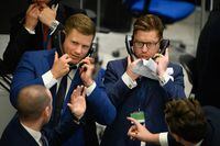 Traders, brokers and clerks shout and gesture on the first day of in-person trading at the London Metal Exchange (LME) on September 06, 2021 in London.