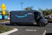 FILE PHOTO: One of  Amazon's  delivery trucks is pictured working on delivery from the Amazon facility in Poway, California, U.S., November 16, 2022. REUTERS/Sandy Huffaker/File Photo