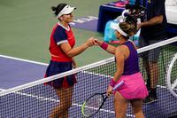 Bianca Andreescu, left, of Canada, shakes hands with Lauren Davis, of the United States, after Andreescu won the match during the second round of the US Open tennis championships, Thursday, Sept. 2, 2021, in New York. (AP Photo/Frank Franklin II)