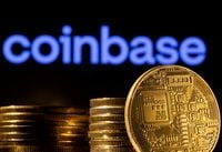FILE PHOTO: A representation of the cryptocurrency is seen in front of Coinbase logo in this illustration taken, March 4.