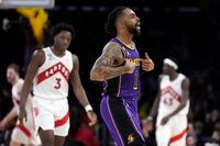 Los Angeles Lakers guard D'Angelo Russell (1) gestures after scoring during the second half of an NBA basketball game against the Toronto Raptors Friday, March 10, 2023, in Los Angeles. (AP Photo/Marcio Jose Sanchez)