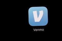 FILE - This March 20, 2018, file photo shows the Venmo app on an iPad in Baltimore. Millennial couples are less likely to combine finances than other generations. But there are benefits to merging accounts and not using Venmo to split bills forever. (AP Photo/Patrick Semansky, File)