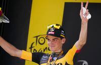 Stage winner Sepp Kuss of the US celebrates on the podium after the fifteenth stage of the Tour de France cycling race over 191.3 kilometers (118.9 miles) with start in Ceret, France, and finish in Andorra-la-Vella, Andorra, Sunday, July 11, 2021. (AP Photo/Daniel Cole)