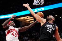Toronto Raptors forward Pascal Siakam (43) drives to the basket as Los Angeles Clippers forward Nicolas Batum (33) defends during second half NBA basketball action in Toronto on Tuesday, December 27, 2022. THE CANADIAN PRESS/Frank Gunn