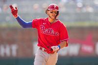 Sep 18, 2022; Cumberland, Georgia, USA; Philadelphia Phillies third baseman Alec Bohm (28) reacts after hitting a home run against the Atlanta Braves during the sixth inning at Truist Park. Mandatory Credit: Dale Zanine-USA TODAY Sports