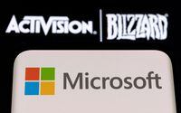 FILE PHOTO: Microsoft logo is seen on a smartphone placed on displayed Activision Blizzard logo in this illustration taken January 18, 2022. REUTERS/Dado Ruvic/Illustration/File Photo