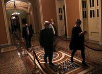 Senate Majority Leader Mitch McConnell leaves the Senate floor as he and the rest of the U.S. Senate face a decision over approving 2,000 dollars stimulus checks on Capitol Hill in Washington, U.S., December 30, 2020.