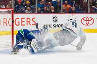 Sep 29, 2022; Vancouver, British Columbia, CAN; Seattle Kraken forward Ryan Donato (9) scores a goal against Vancouver Canucks goalie Arturs Silvos (31) in overtime at Rogers Arena. Seattle won 4-3 in overtime. Mandatory Credit: Bob Frid-USA TODAY Sports
