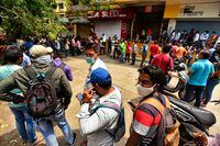 People queue outside the Chemists Association office for Remdesivir, an antiviral drug, in Pune on April 9, 2021 as India surged past 13 million coronavirus cases. (Photo by - / AFP) (Photo by -/AFP via Getty Images)