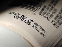A "best before" date is shown on a food container in Toronto, Tuesday, July 4, 2023. A report from a House committee is recommending the government take another look at its rules around best before dates in an effort to cut down on food waste. THE CANADIAN PRESS/Giordano Ciampini