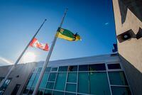 The Canadian and Saskatchewan flags fly at half mast the morning before funeral services for radio broadcaster Tyler Bieber, one of the people killed in the bus crash carrying the Humboldt Broncos Junior A hockey team, in Humboldt, Saskatchewan, Canada, April 12, 2018.  REUTERS/Matt Smith