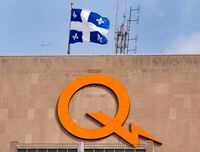 A Hydro-Quebec logo is seen on their head office building in Montreal, Thursday, Feb. 26, 2015.&nbsp;Some Quebec government websites taken offline Sunday due to a massive software vulnerability are back online.THE CANADIAN PRESS/Ryan Remiorz