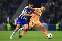 Atletico Madrid's Angel Correa, right, challenges for the ball with Porto's Stephen Eustaquio during a Champions League group B soccer match between FC Porto and Atletico Madrid at the Dragao stadium in Porto, Portugal, Tuesday, Nov. 1, 2022. Eustaquio and Evelyne Viens have been named Canada Soccer's players of the month for October. Eustaquio helped FC Porto qualify for the round of 16 in UEFA Champions League while Viens excelled in a pair of Canada wins in October international friendlies in Europe. THE CANADIAN PRESS/AP-Luis Vieira